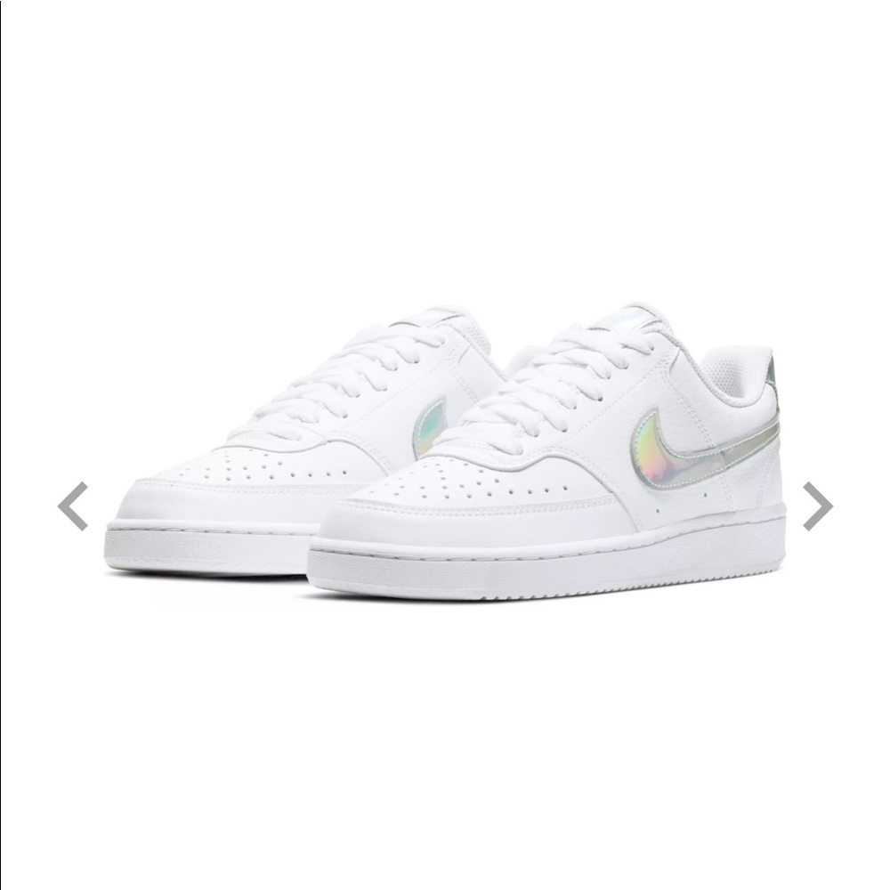 White nikes with silver swoosh
